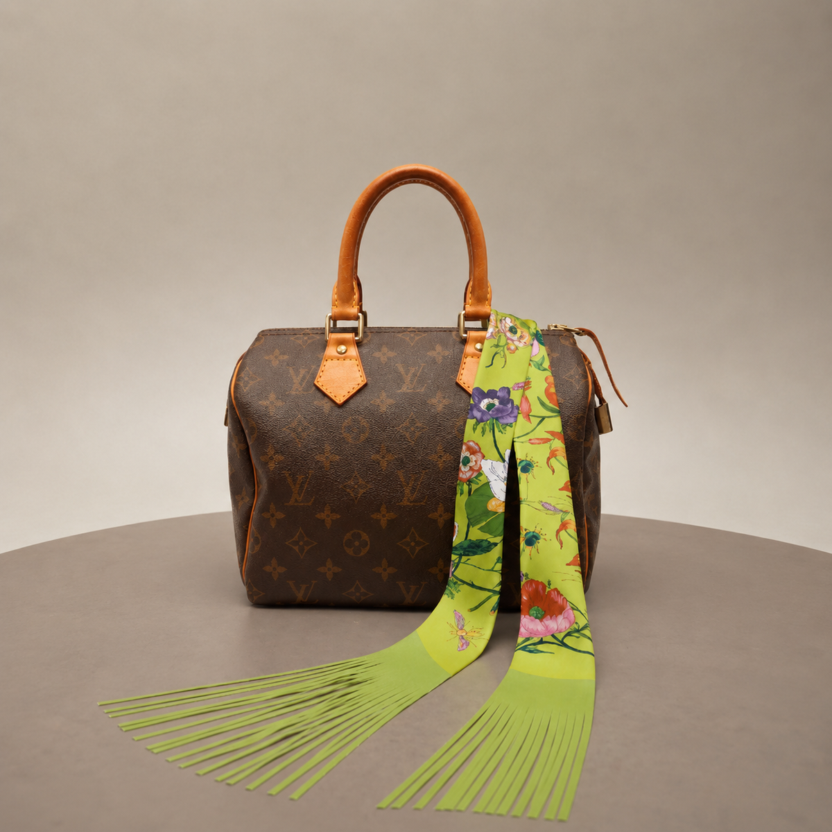 Printed scarf tied to a handbag