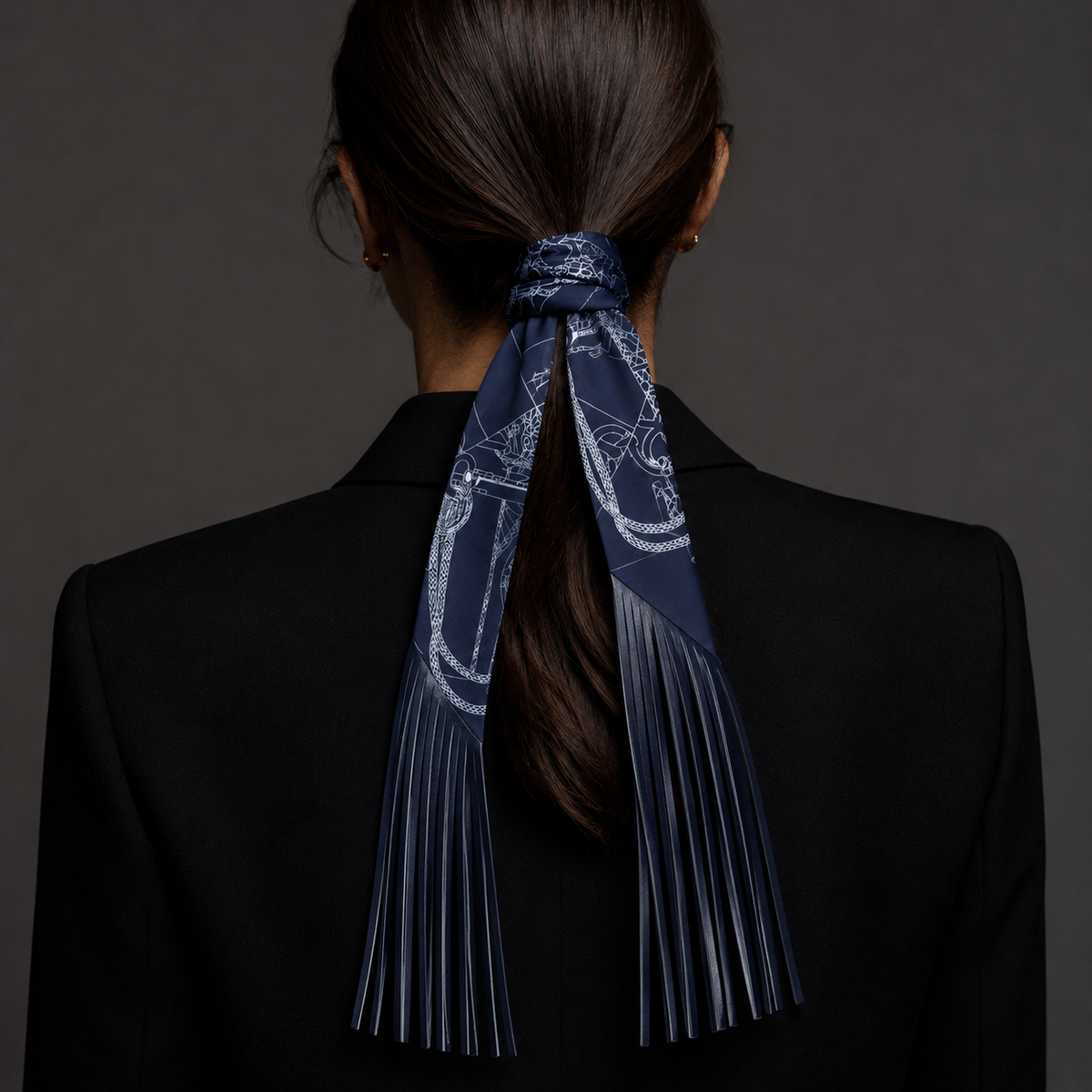 Printed scarf tied around a ponytail